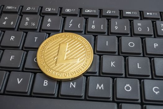 close up cryptocurrency coins on keyboard background