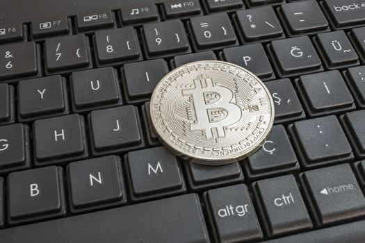 close up cryptocurrency coins on keyboard background