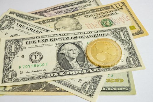 close up cryptocurrency coins on banknotes background