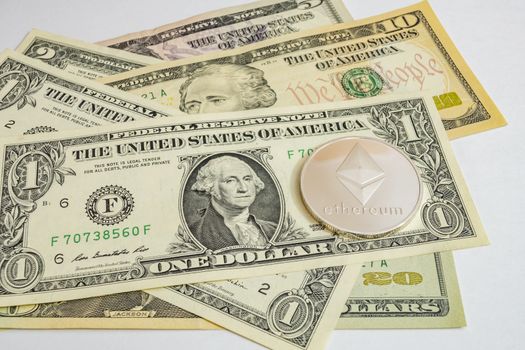 close up cryptocurrency coins on banknotes background