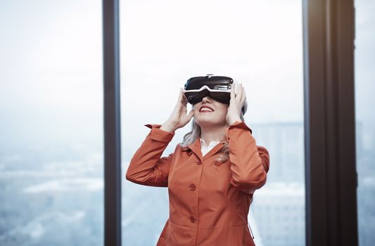 Woman at office wearing Virtual reality headset