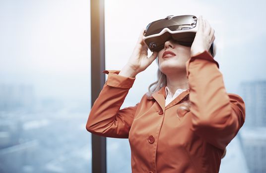 Woman at office wearing Virtual reality headset