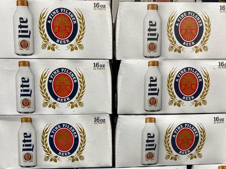 Orlando, FL/USA-5/15/20: Cases of cans of Miller Lite Beer at a grocery store waiting for customers to purchase.  Miller Lite is a product of American Miller Brewing Company.