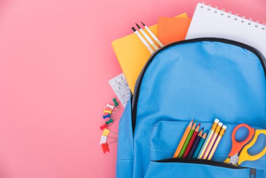 Blue bag backpack for education children on pink background back to school concept