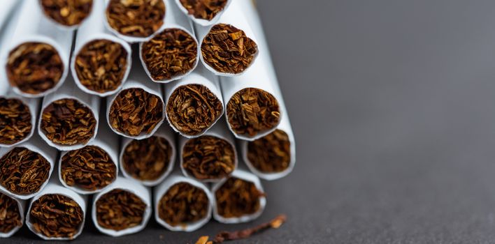 31 May of World No Tobacco Day, Close up front stack pile cigarette or tobacco on black background with copy space, Warning lung health concept