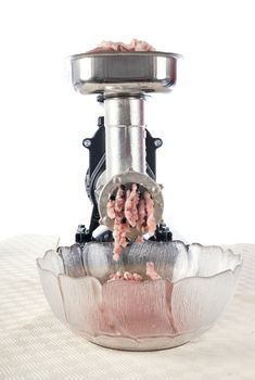 meat mincer in front of white background