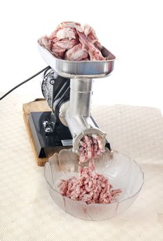 meat mincer in front of white background