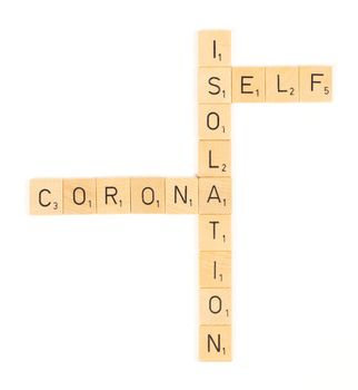 Corona self isolation scrable letters, isolated on a white background