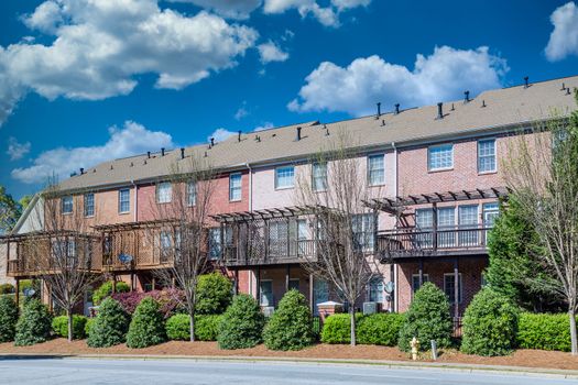 Back of Brick Townhouses under blue sky