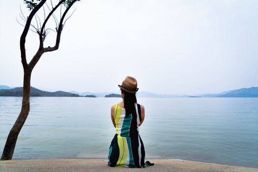traveler woman enjoy looking at beautiful lake with mountains on background