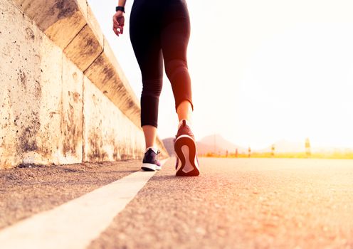 sport woman walking towards on the road side. Step concept