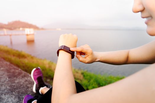 smart band, women touching fitness smart band after workout