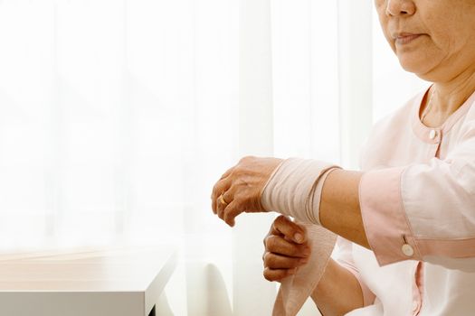 old woman suffering from wrist hand pain, health problem concept