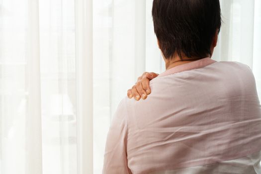 neck and shoulder pain, old woman suffering from neck and shoulder injury, health problem concept