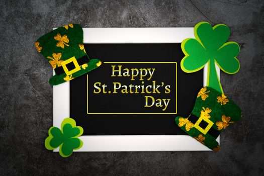 St Patricks day, festive leprechaun hat and green Shamrocks on photo frame