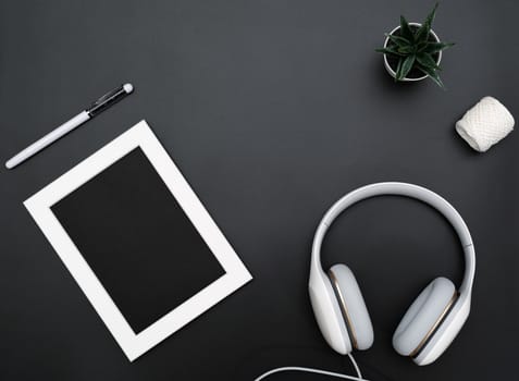 Mockup, Photo Frame, Headphones, Pen, and Cactus Write object on Black background
