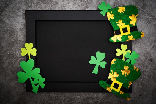 St Patricks day, festive leprechaun hat and green Shamrocks on photo frame
