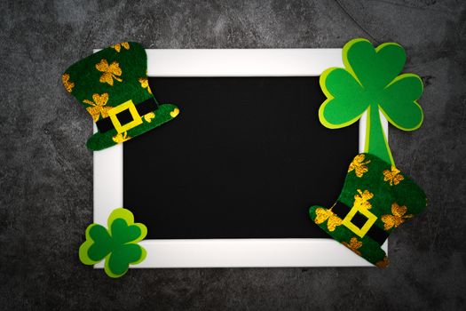 St Patricks day, festive leprechaun hat and green Shamrocks on photo frame
