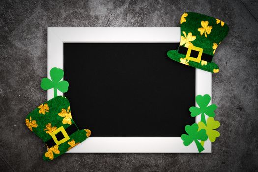 St Patricks day, festive leprechaun hat and green Shamrocks on photo frame