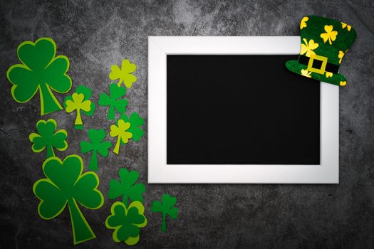 St Patricks day, festive leprechaun hat and green Shamrocks on photo frame
