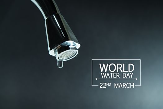 world water day, water drop on faucet with  black backgrounds