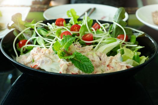 Tuna Salad with fresh mint and cherry tomato. Home made food. Concept for a tasty and healthy meal