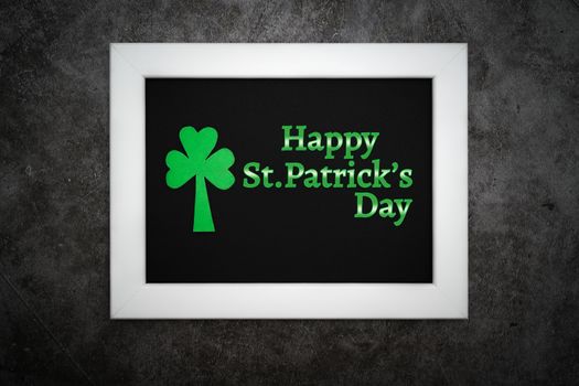 St Patricks day, festive leprechaun hat and green Shamrocks on photo frame