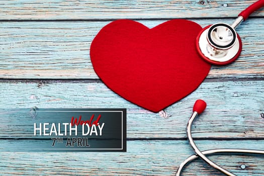 World health day, healthcare and medical concept, red stethoscope and red heart on the blue wooden background