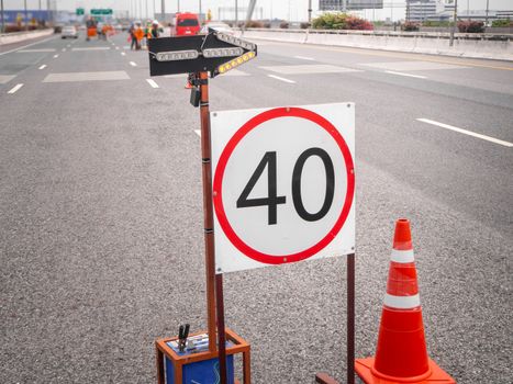 The signs repairs road and worker on the road