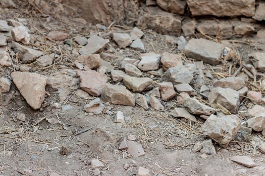 some broken stones had dropped at ground from ancient walls. photo has taken at izmir/turkey.