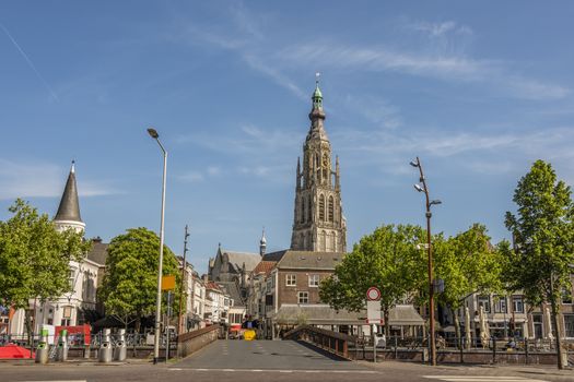 Bridge and main street entrance to the city of Breda. Stresses the tower of the great church of Breda. Netherlands