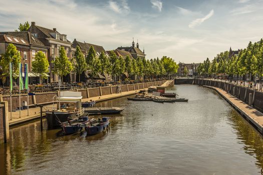 walk along a canal with boats and restaurants in the center of the city of Breda. netherlands europe