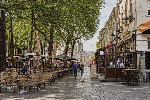 walk and restaurant terraces in the center of the city of breda in the background you can see the great church. Netherlands Netherlands