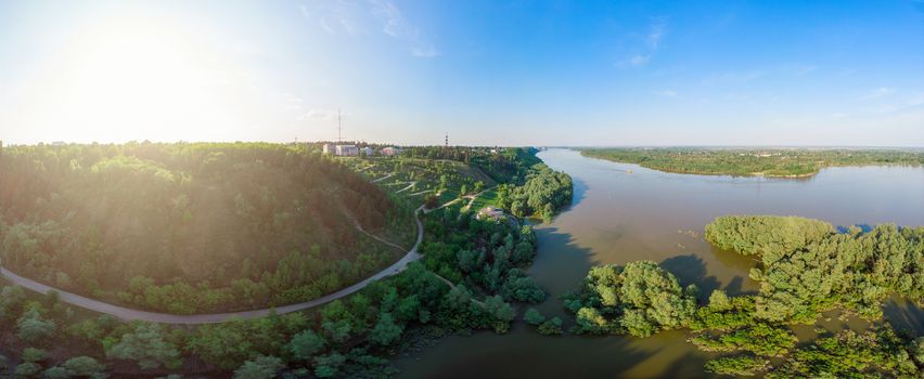 Big horisontal drone panorama, aerial top vew of winding road in the city Barnaul with Ob river