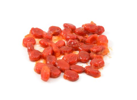 Bitter melon seeds covered in sticky red pith - momordica charantia - isolated on a white background