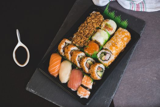 Raw fresh Salmon sushi roll maki - japanese food.