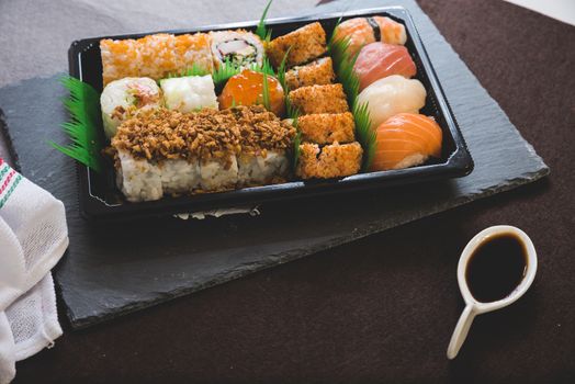 Raw fresh Salmon sushi roll maki - japanese food.