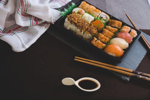 Raw fresh Salmon sushi roll maki - japanese food.