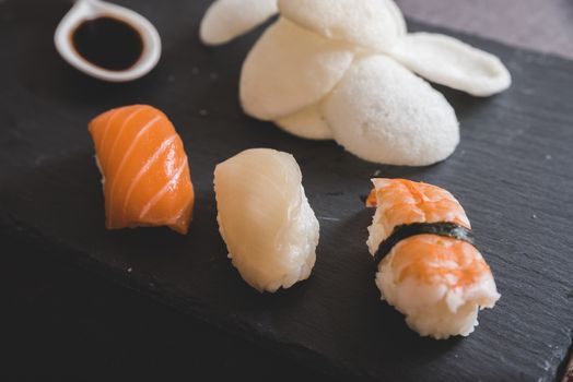 Raw fresh Salmon sushi roll maki - japanese food.