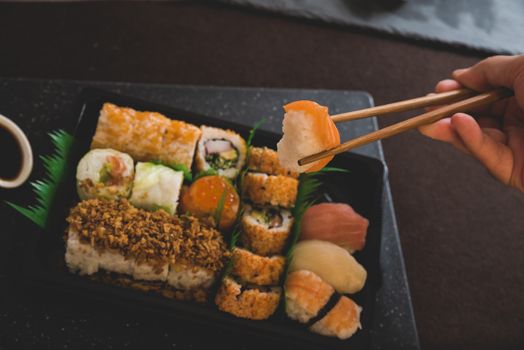 Raw fresh Salmon sushi roll maki - japanese food.