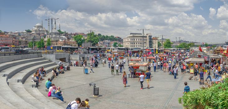 Istambul, Turkey – 07.13.2019. Many people on the Eminonu Embankment near the Galata bridge in Istanbul, on a sunny summer day