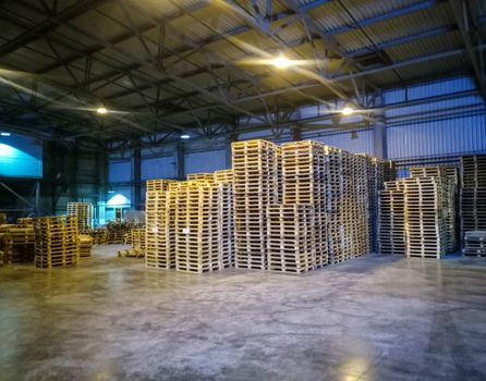 Pallet racks inside a cement plant. Loading shop of a cement plant.