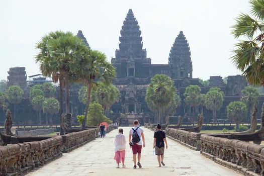 people walking up to angkor wat in cambodia siem reap