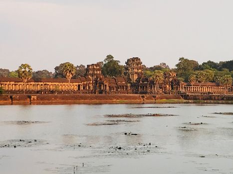 Siem reap cambodia sun set golden hour temple with trees angkor wat