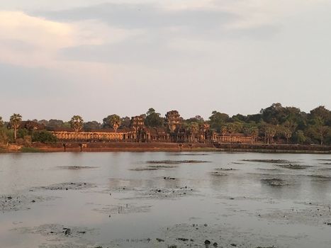 Siem reap cambodia sun set golden hour temple with trees angkor wat