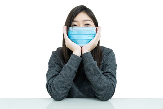 Close up woman long hair propping up chin with his hands and wearing protective mask for protection against virus Covid-19 on white