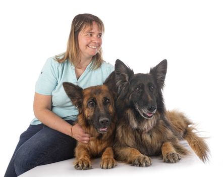 german shepherds and woman in front of white background