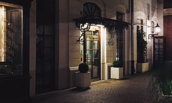 Exterior facade of classic building in the European city at night, architecture and design detail