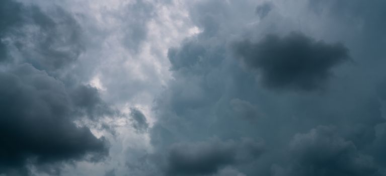 Dark dramatic sky and clouds. Background for death and sad concept. Gray sky and fluffy white clouds. Thunder and storm sky. Sad and moody sky. Nature background. Dead abstract background. Cloudscape.