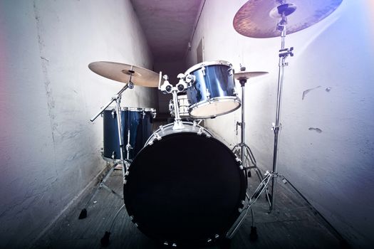 Drums conceptual image. Picture of drums and drumsticks lying on snare drum. Retro vintage instagram picture.